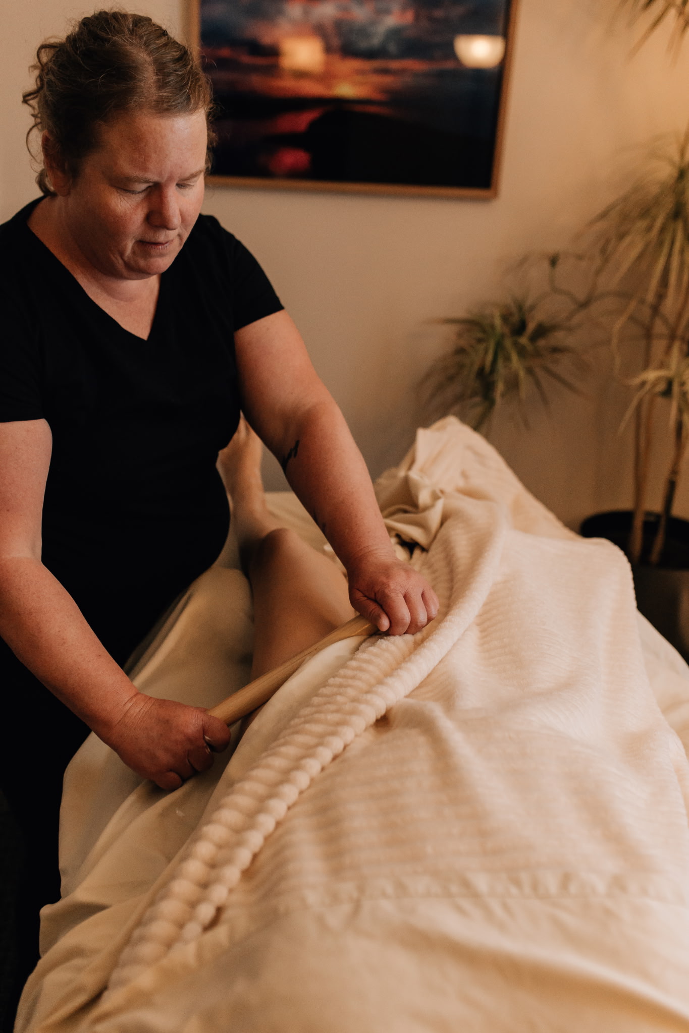 Warm bamboo massage on the legs in Murray, Utah