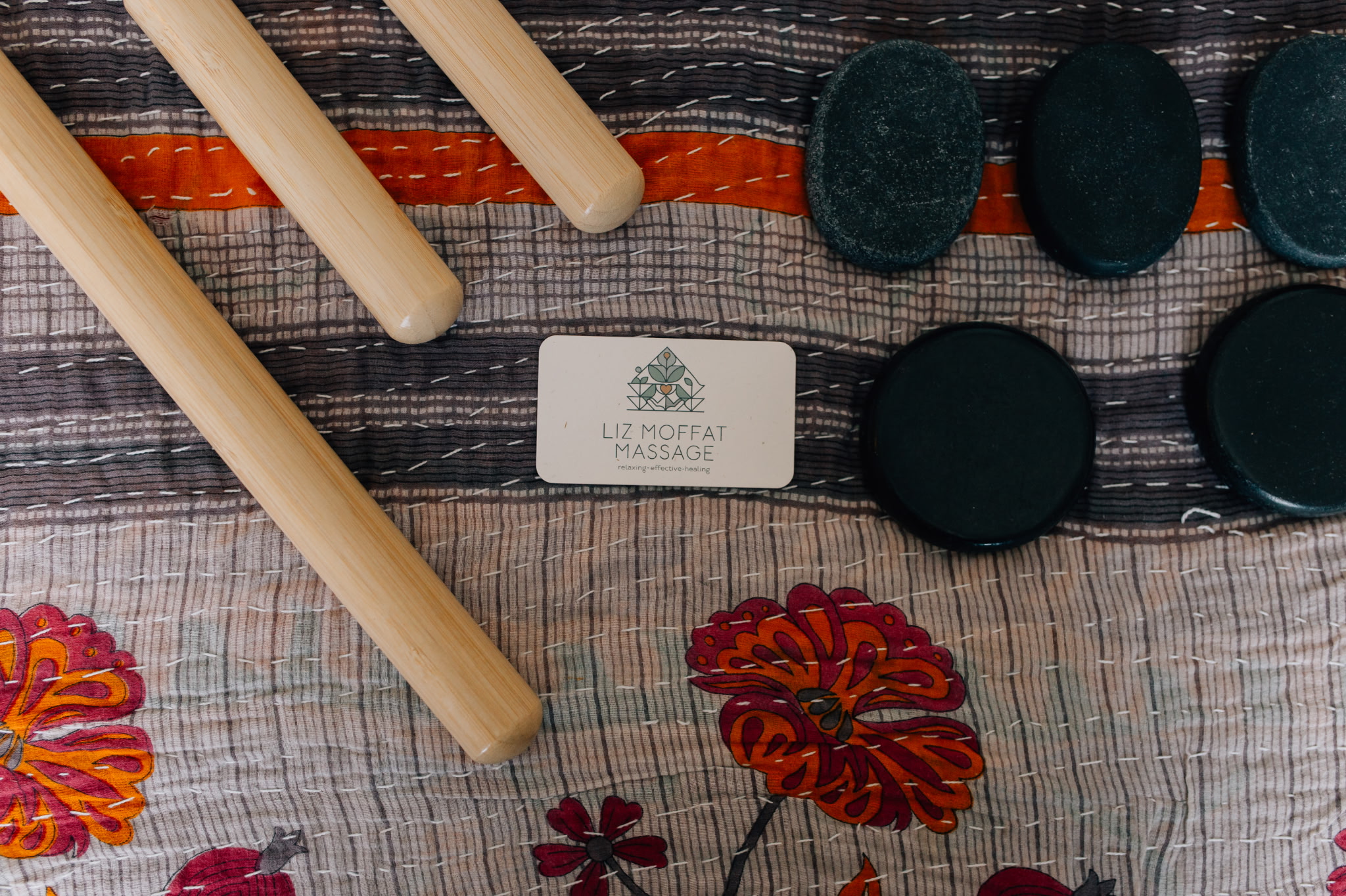 Warm bamboo sticks and basalt massage stones at Liz Moffat Massage in Murray, Utah